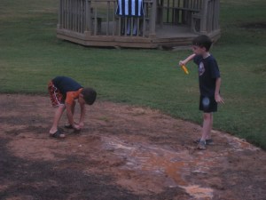 Muddy boys playing in the rain at The Cochise Club in Vinings. 