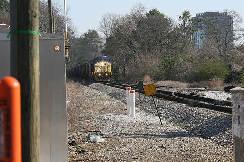 Vinings_Train A switch from coal-burning to natural gas powered at the nearby Plant McDonough may mean a 38% reduction in trains rolling through Vinings on a daily basis....during the year 2012! Photo by Flickr user Bartlett2.