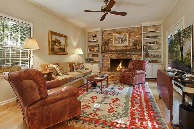 3225_Laramie_Drive_Atlanta_For_Sale_LivingRoom A light-filled living room is anchored by a cozy fireplace in this Vinings home for sale. Click on the image for more photos and information.