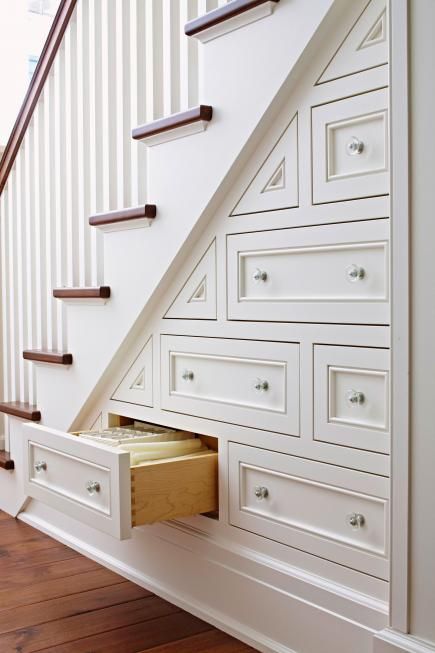 Great built-in drawers for using space under the stairs for storage. photo credit: midwestliving.com