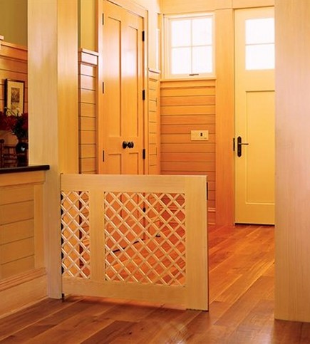 Pocket gates keep babies safe around stairs and help contain pets in certain areas of the house. photo credit: atticmag.com